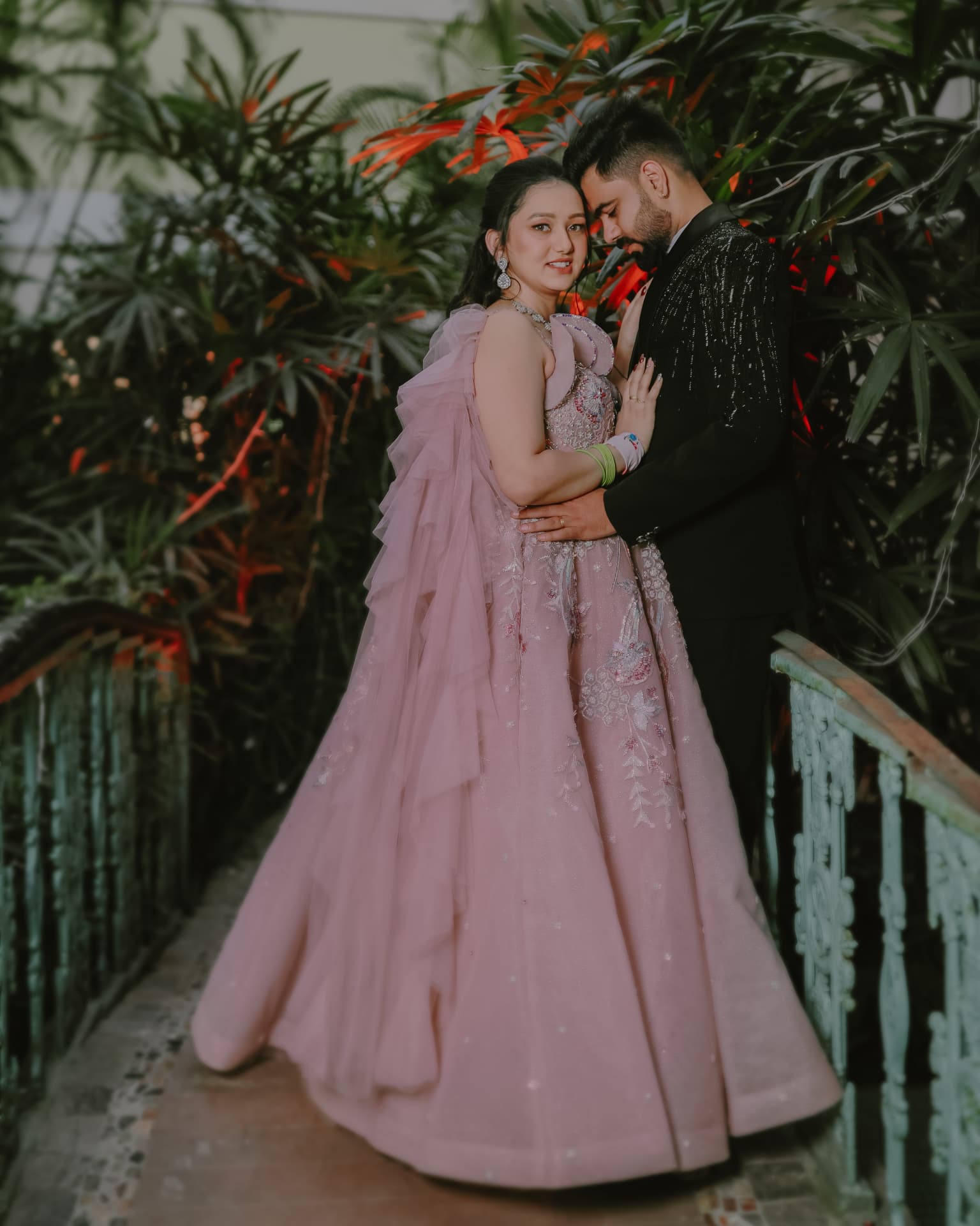 Anand and Soumya on the garden bridge at their Gurugram engagement, Club Patio South City