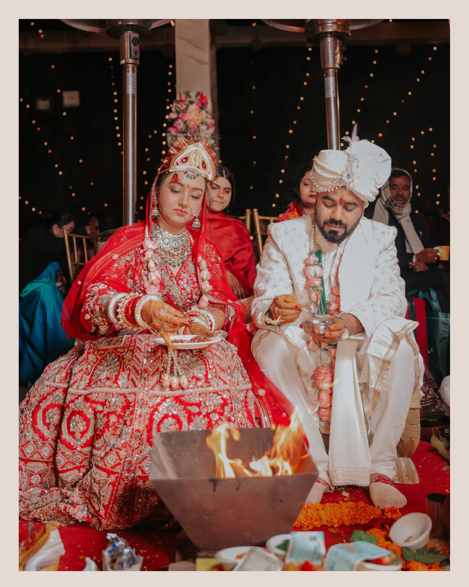 Anand and Soumya at the mandap during their Gurugram wedding ceremony, performing the havan rites