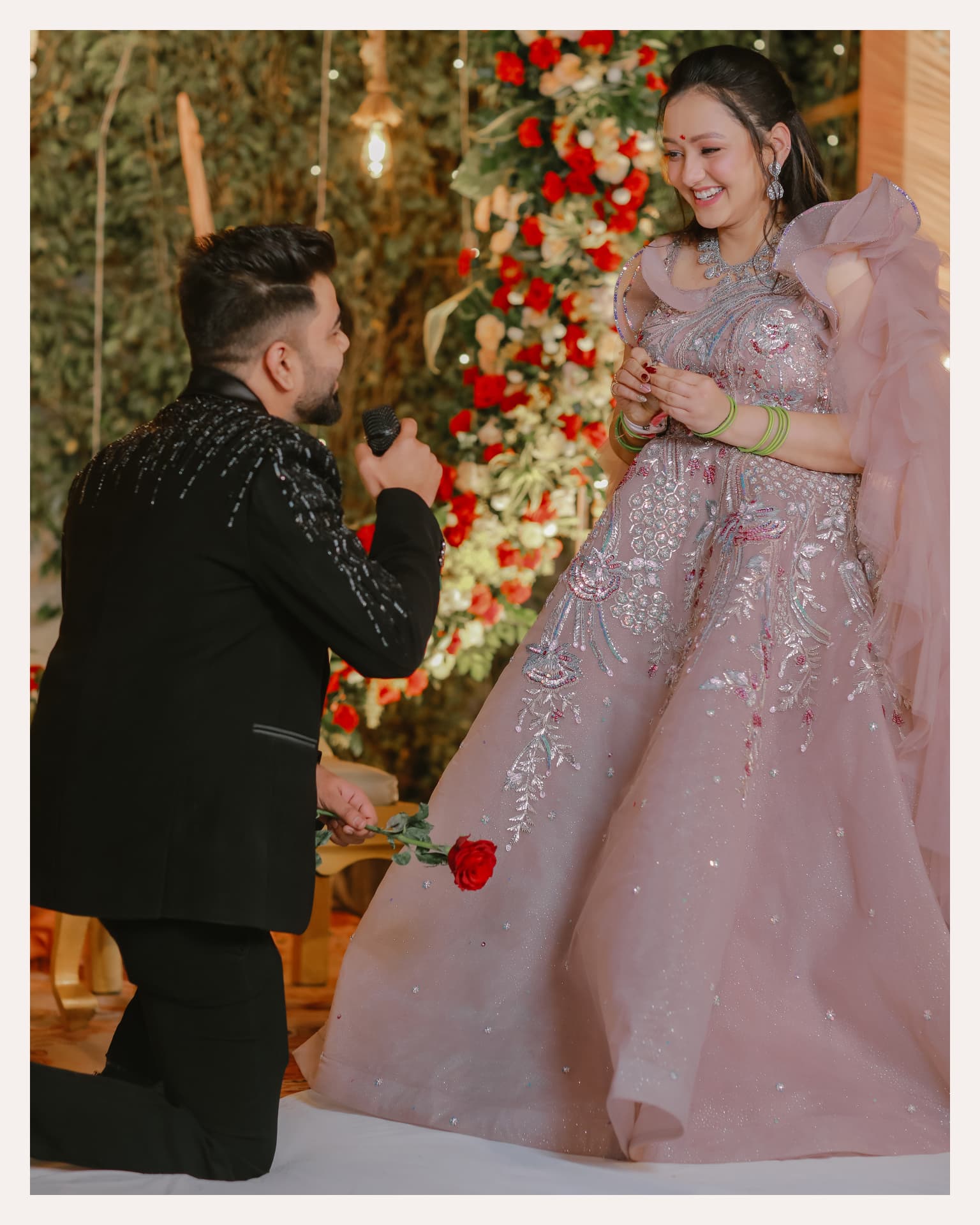Anand proposing to Soumya with a rose at their Gurugram engagement, Club Patio South City