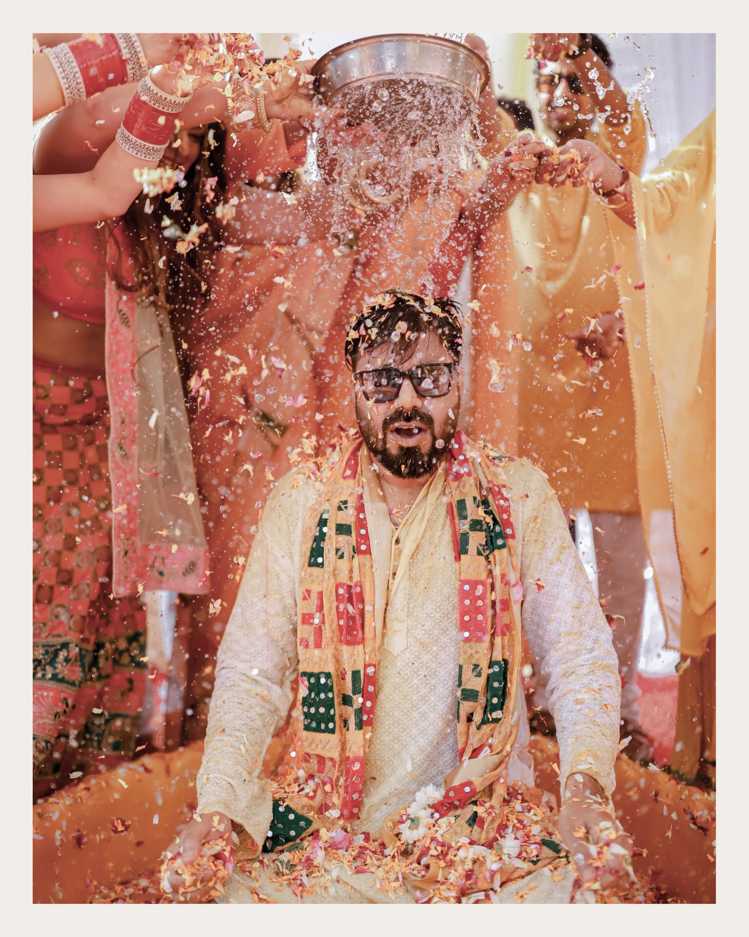 Haldi ceremony celebrations in Sector 31, Gurugram — turmeric and petals poured over Anand